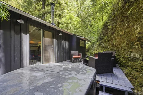 a backyard of a house with seating space