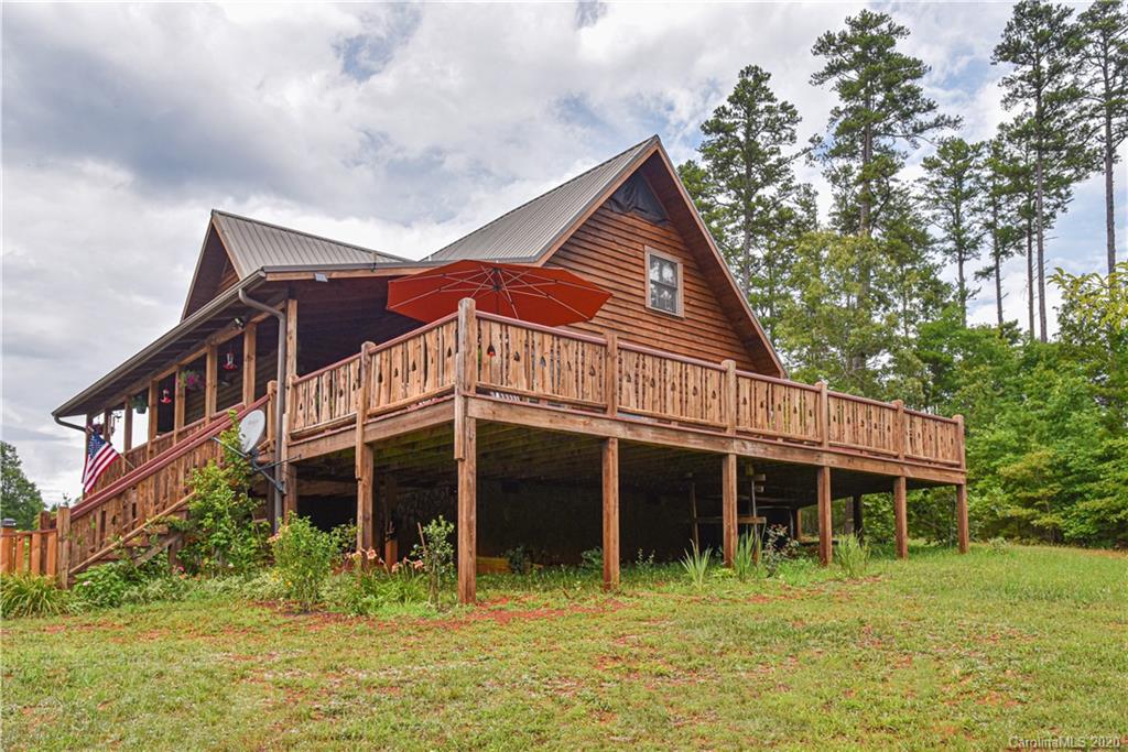 359 Dark Corner Road Rutherfordton, NC 28139 - Photo 2 of 36 a front view of a house with a yard