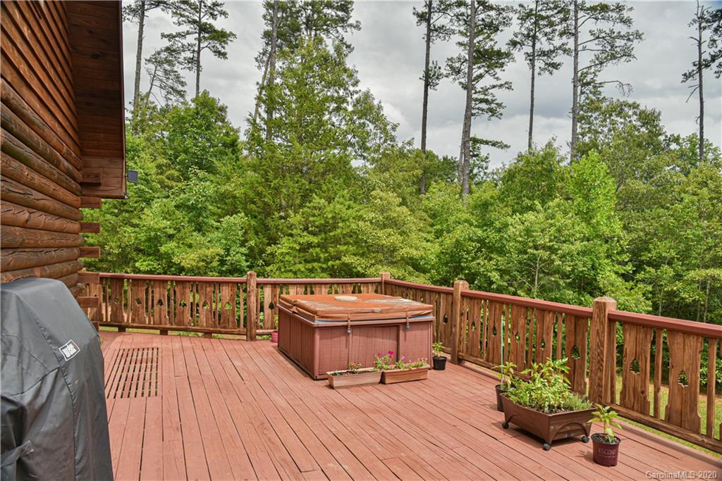 359 Dark Corner Road Rutherfordton, NC 28139 - Photo 12 of 36 a view of balcony with wooden floor and outdoor seating