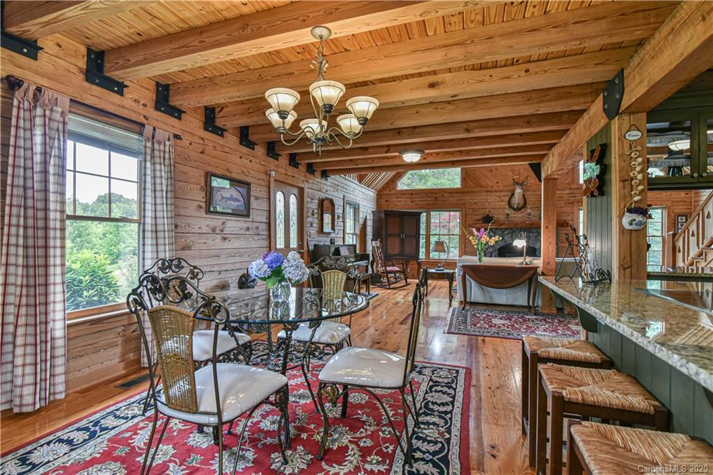 359 Dark Corner Road Rutherfordton, NC 28139 - Photo 17 of 36 a dining room with furniture a rug and wooden floor