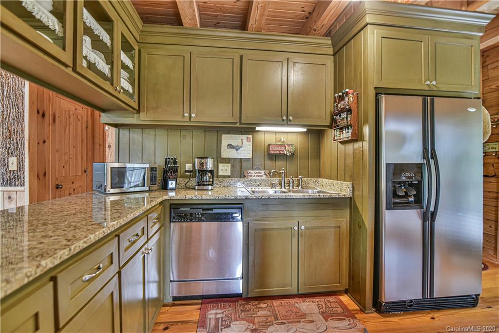 359 Dark Corner Road Rutherfordton, NC 28139 - Photo 20 of 36 a kitchen with stainless steel appliances granite countertop a sink a stove and refrigerator