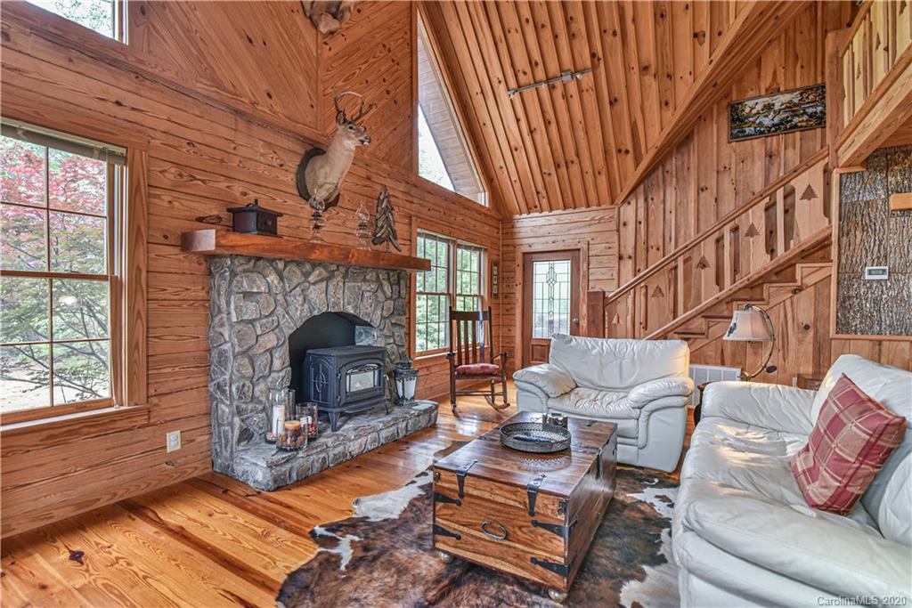 359 Dark Corner Road Rutherfordton, NC 28139 - Photo 22 of 36 a living room with furniture a fireplace and a large window