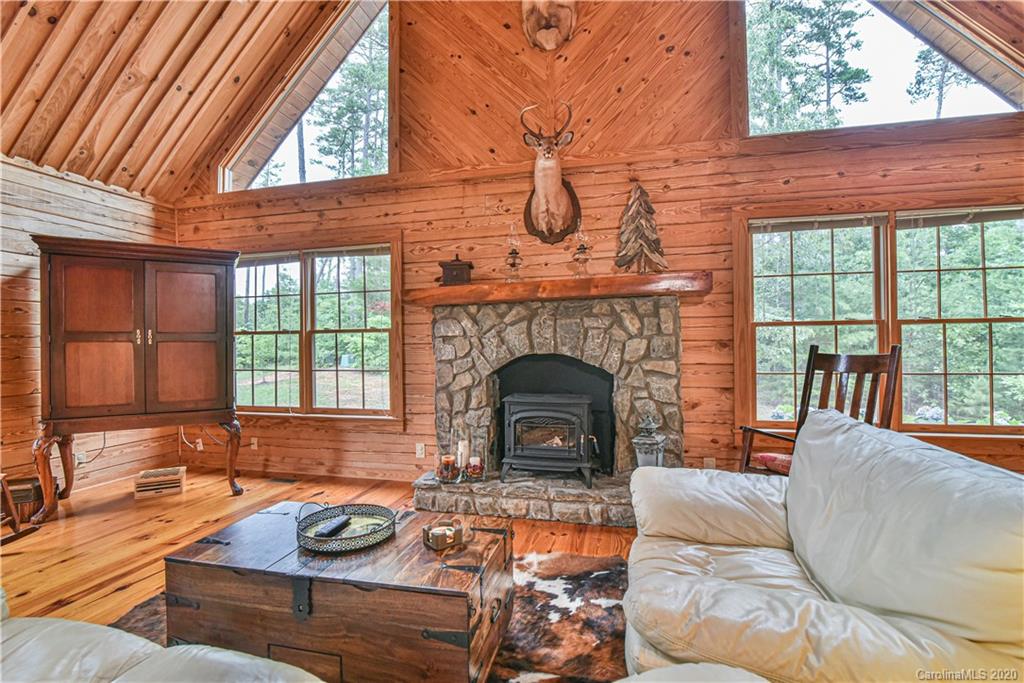359 Dark Corner Road Rutherfordton, NC 28139 - Photo 25 of 36 a living room with furniture a fireplace and a large window