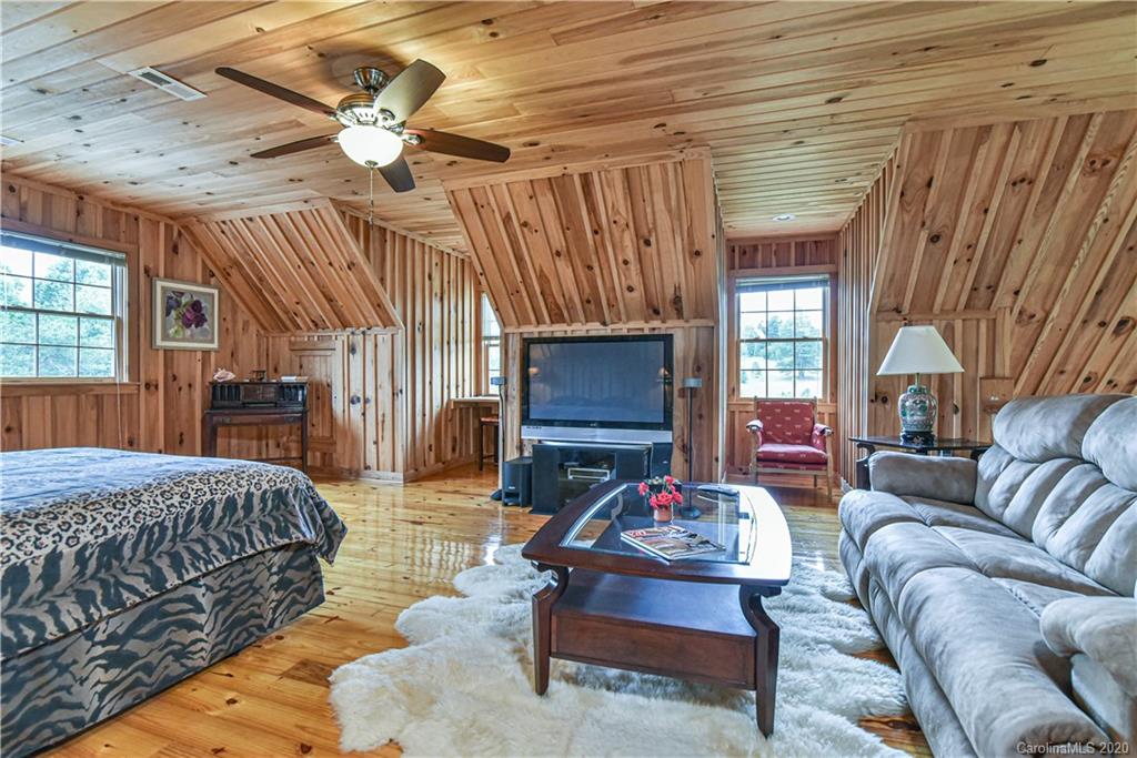 359 Dark Corner Road Rutherfordton, NC 28139 - Photo 31 of 36 a bedroom with furniture and a fireplace
