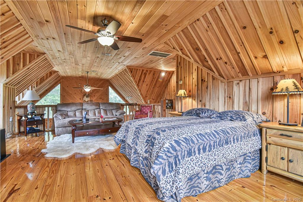 359 Dark Corner Road Rutherfordton, NC 28139 - Photo 32 of 36 a bed sitting in a spacious bedroom next to a larger window