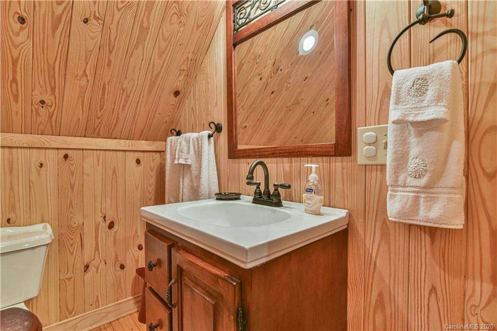 359 Dark Corner Road Rutherfordton, NC 28139 - Photo 33 of 36 a bathroom with a sink and mirror