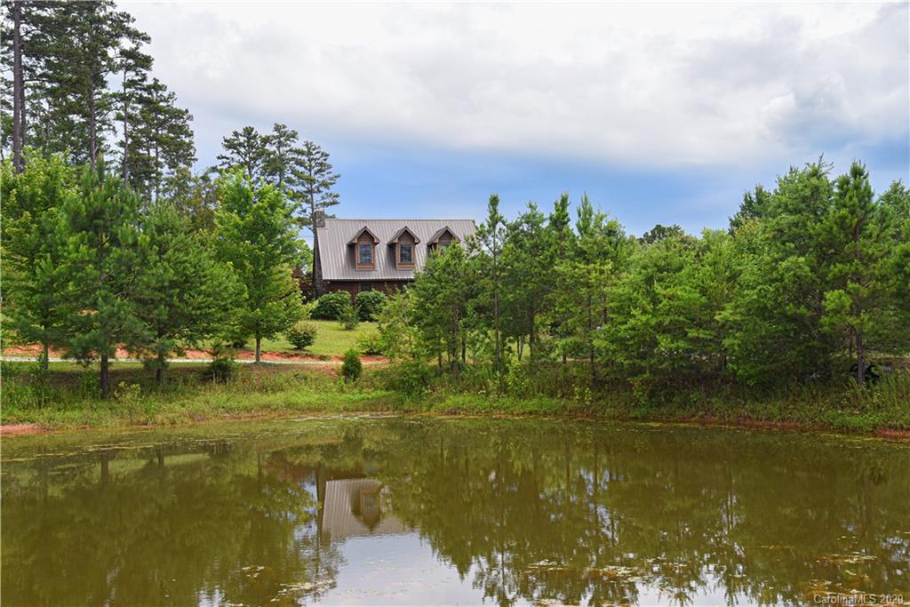 359 Dark Corner Road Rutherfordton, NC 28139 - Photo 6 of 36 a view of a lake with houses in the background