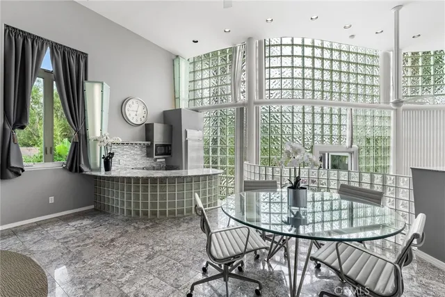 a dining room with furniture and window