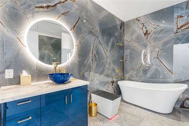 a bathroom with a sink a toilet and a shower