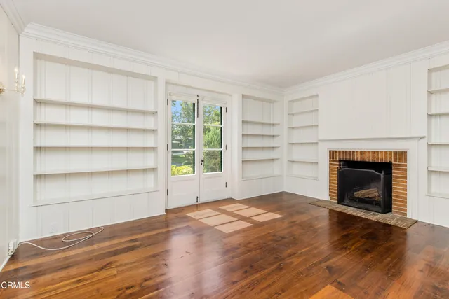 a kitchen with sink cabinets and wooden floor