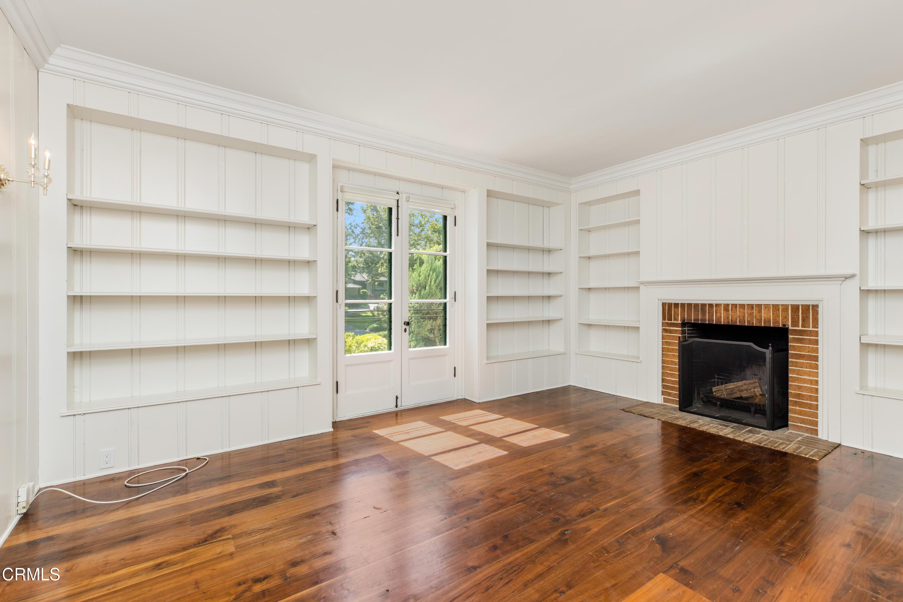 1184 Arden Road Pasadena, CA 91106 - Photo 13 of 62 a view of an empty room with a fireplace and a window