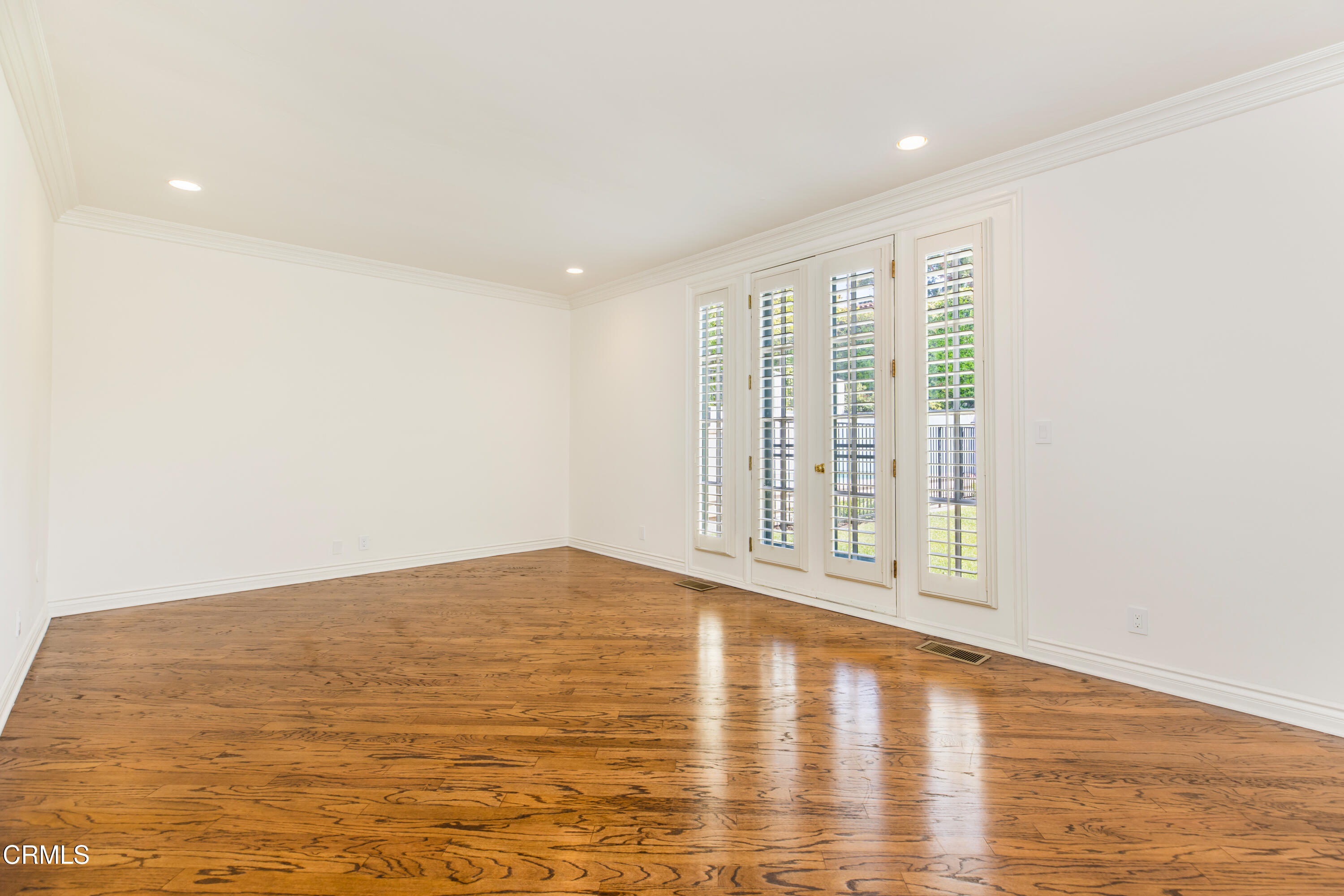 1184 Arden Road Pasadena, CA 91106 - Photo 22 of 62 a view of an empty room with wooden floor and a window