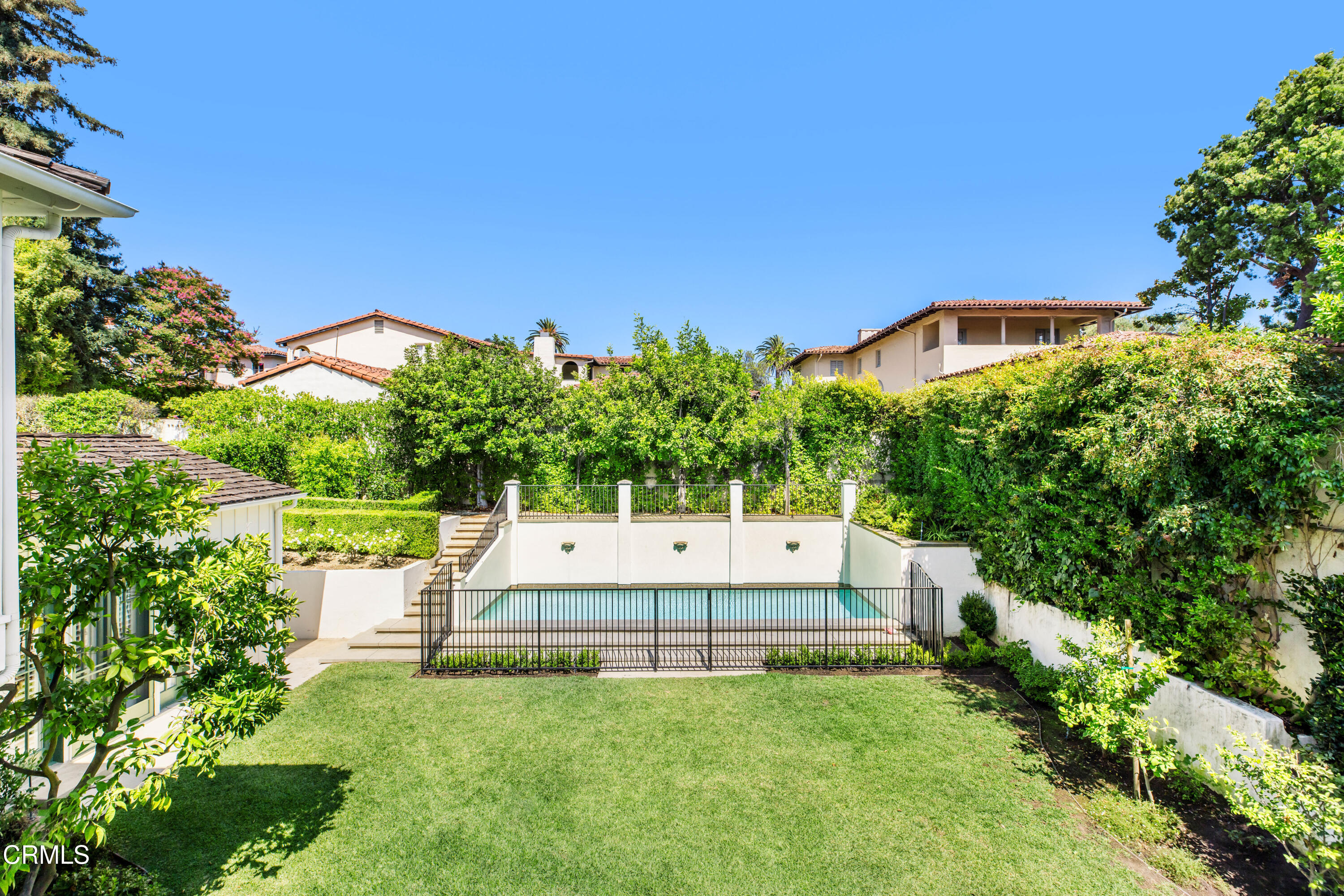 1184 Arden Road Pasadena, CA 91106 - Photo 35 of 62 a backyard of a house with plants and large trees