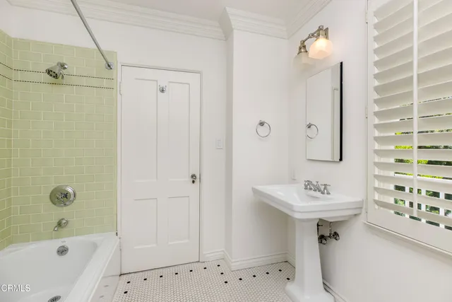 a view of a white house with a yard