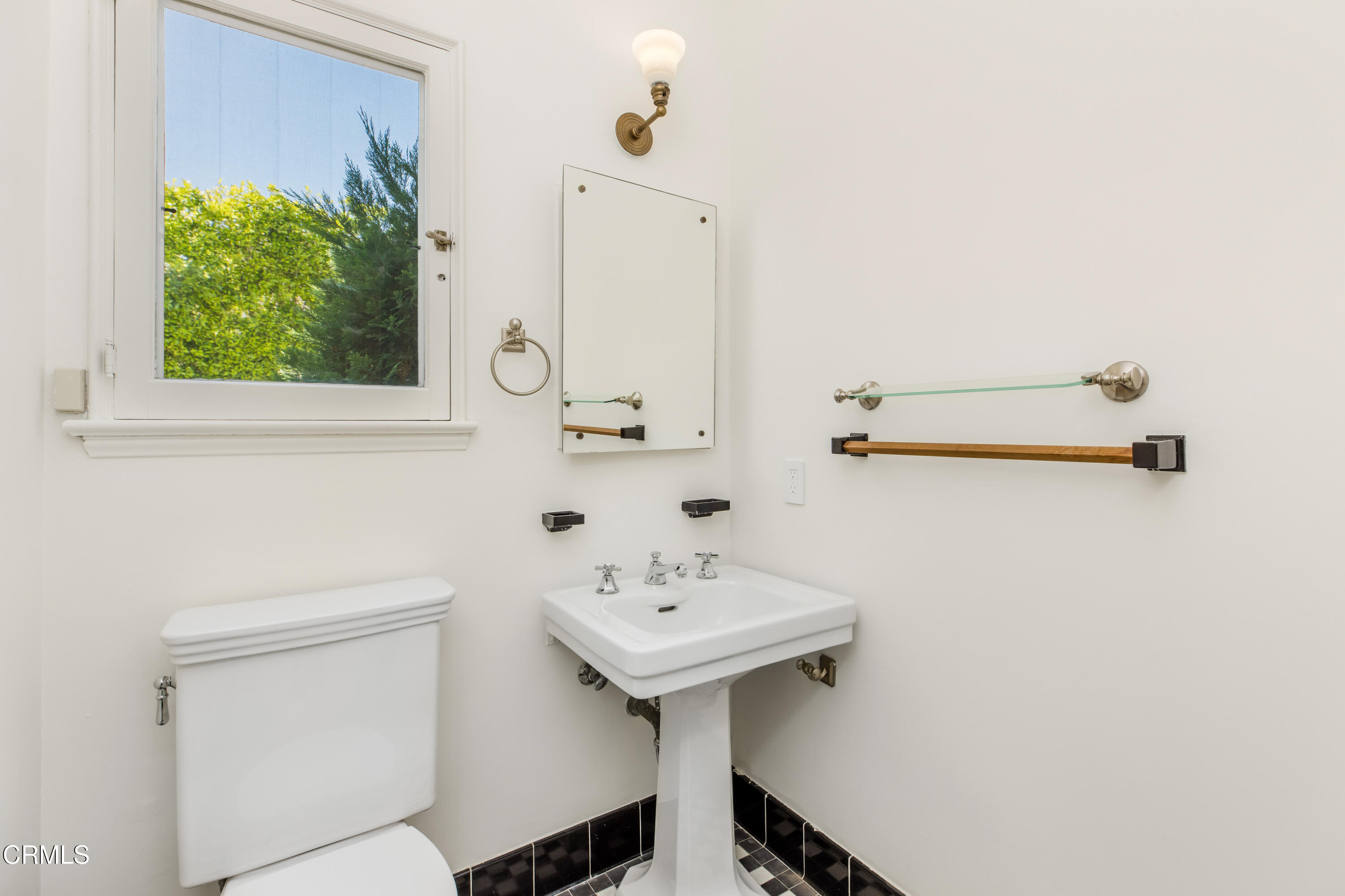 1184 Arden Road Pasadena, CA 91106 - Photo 56 of 62 a bathroom with a sink and a mirror
