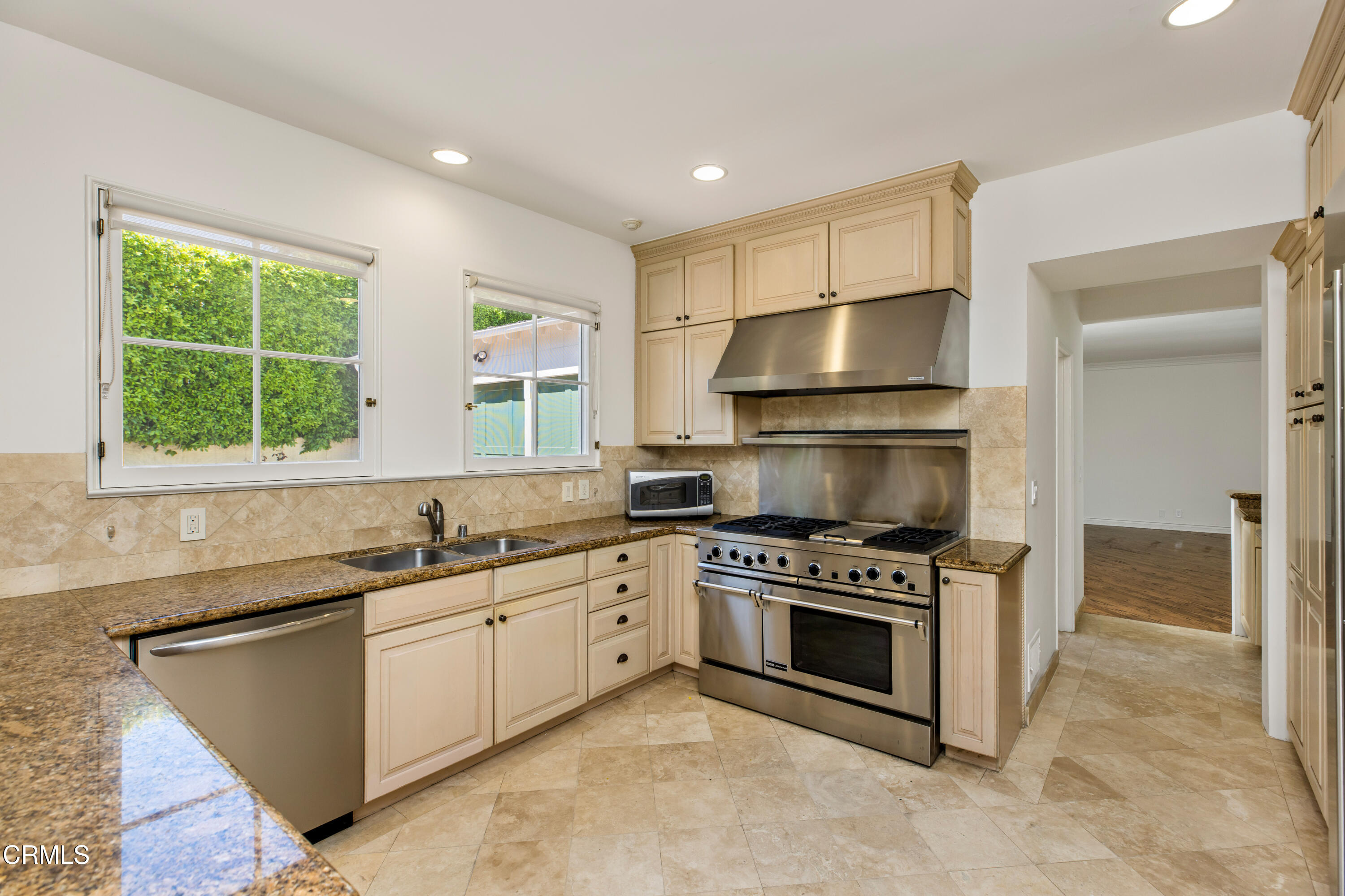 1184 Arden Road Pasadena, CA 91106 - Photo 8 of 62 a kitchen with stainless steel appliances a stove sink and cabinets