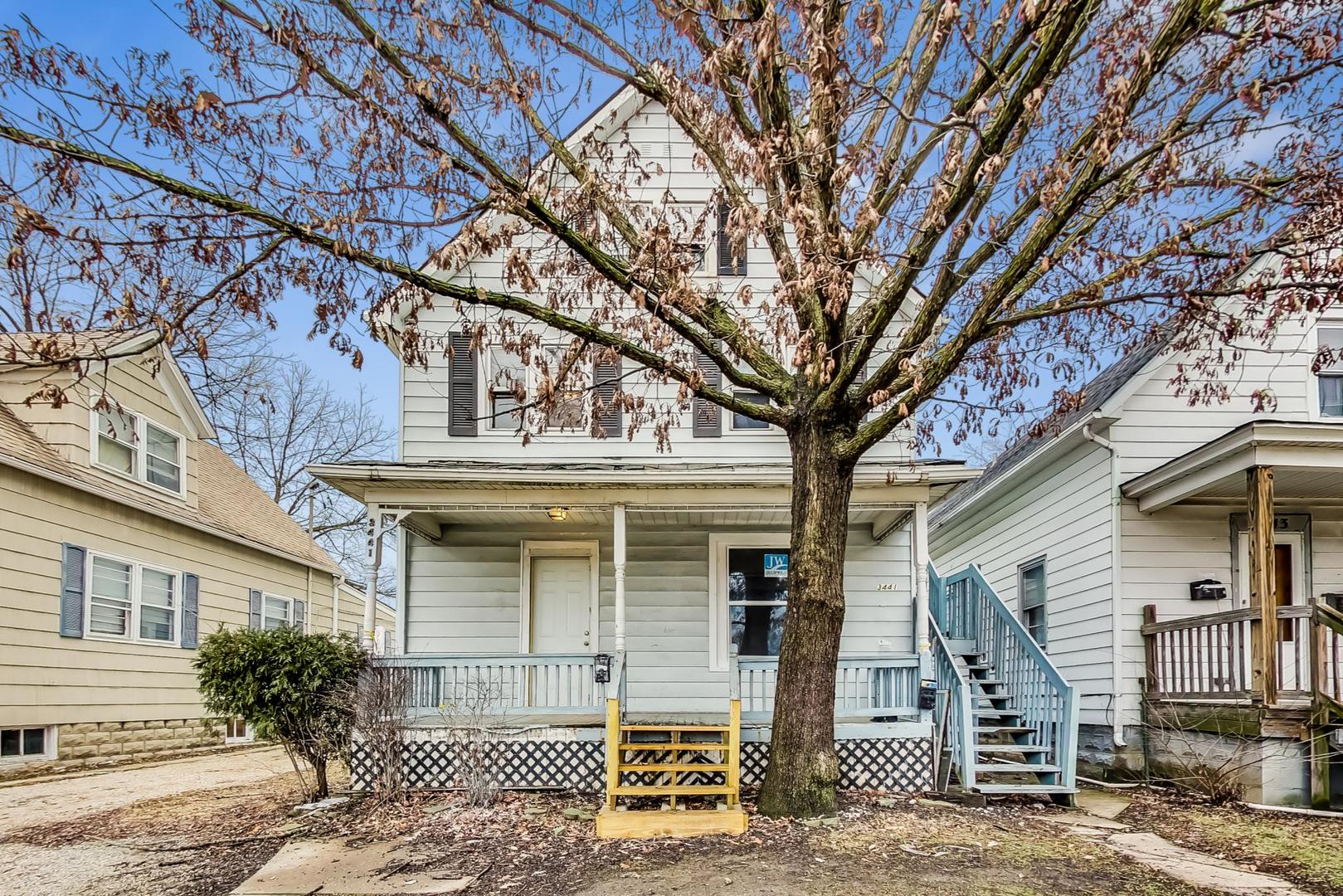a front view of a house with garage