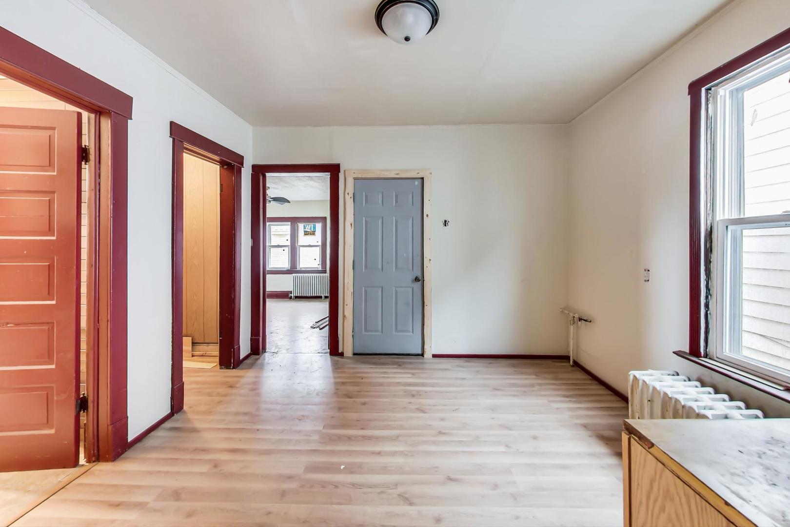3441 Chicago Road Steger, IL 60475 - Photo 12 of 31 a view of an empty room with window and wooden floor