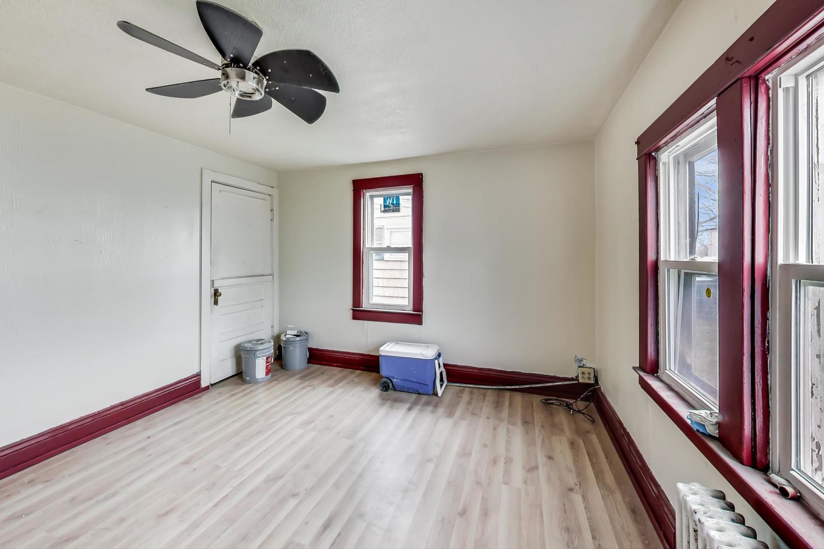 3441 Chicago Road Steger, IL 60475 - Photo 16 of 31 a view of room with a ceiling fan and window
