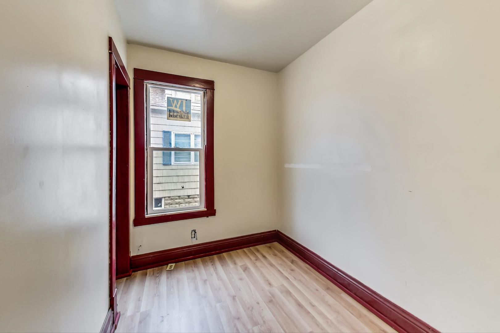 3441 Chicago Road Steger, IL 60475 - Photo 21 of 31 a view of a hallway with wooden floor and a window