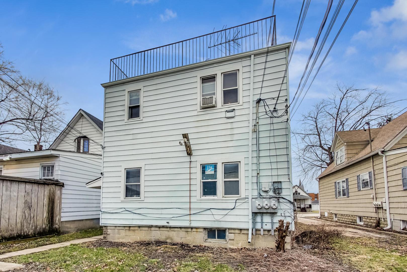 3441 Chicago Road Steger, IL 60475 - Photo 27 of 31 a view of a white house with large windows