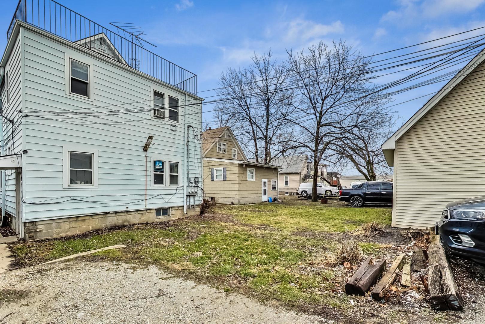 3441 Chicago Road Steger, IL 60475 - Photo 29 of 31 a view of a house with a yard and sitting area