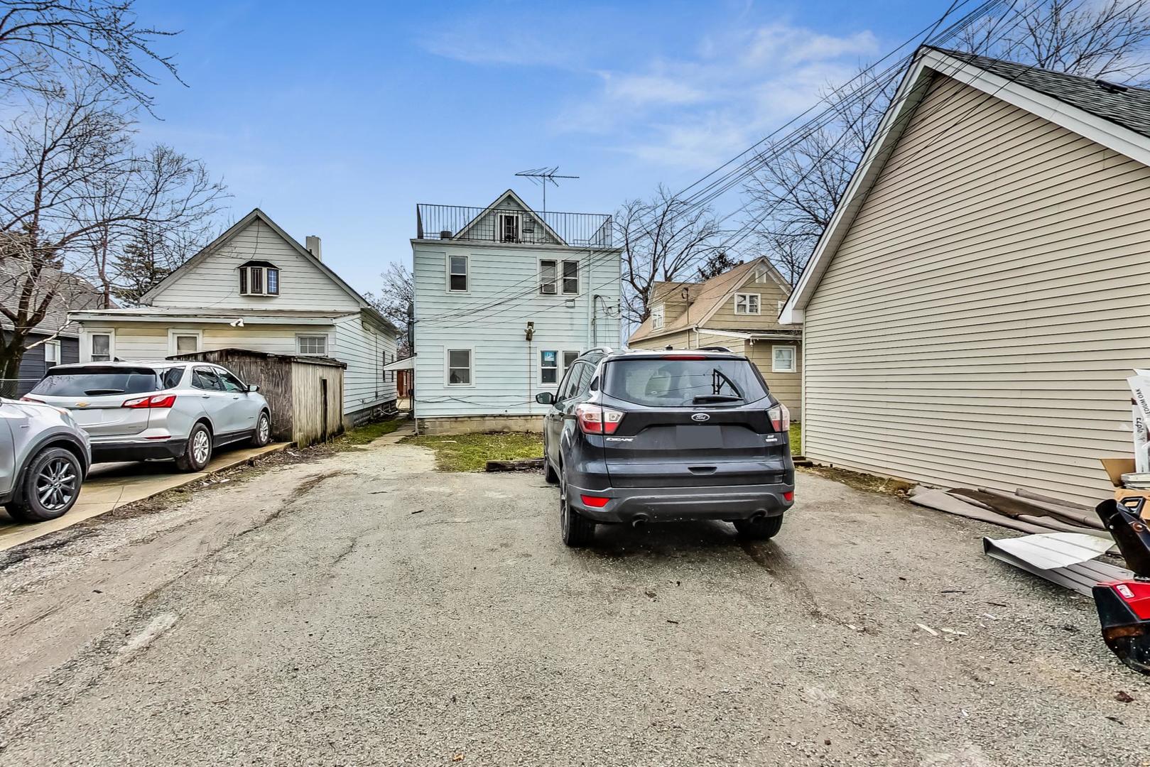 3441 Chicago Road Steger, IL 60475 - Photo 30 of 31 a view of cars parked in front of a house