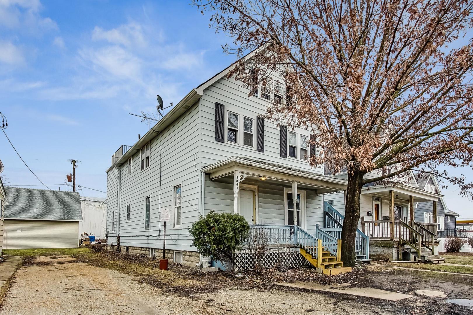 3441 Chicago Road Steger, IL 60475 - Photo 3 of 31 a front view of a house with garden