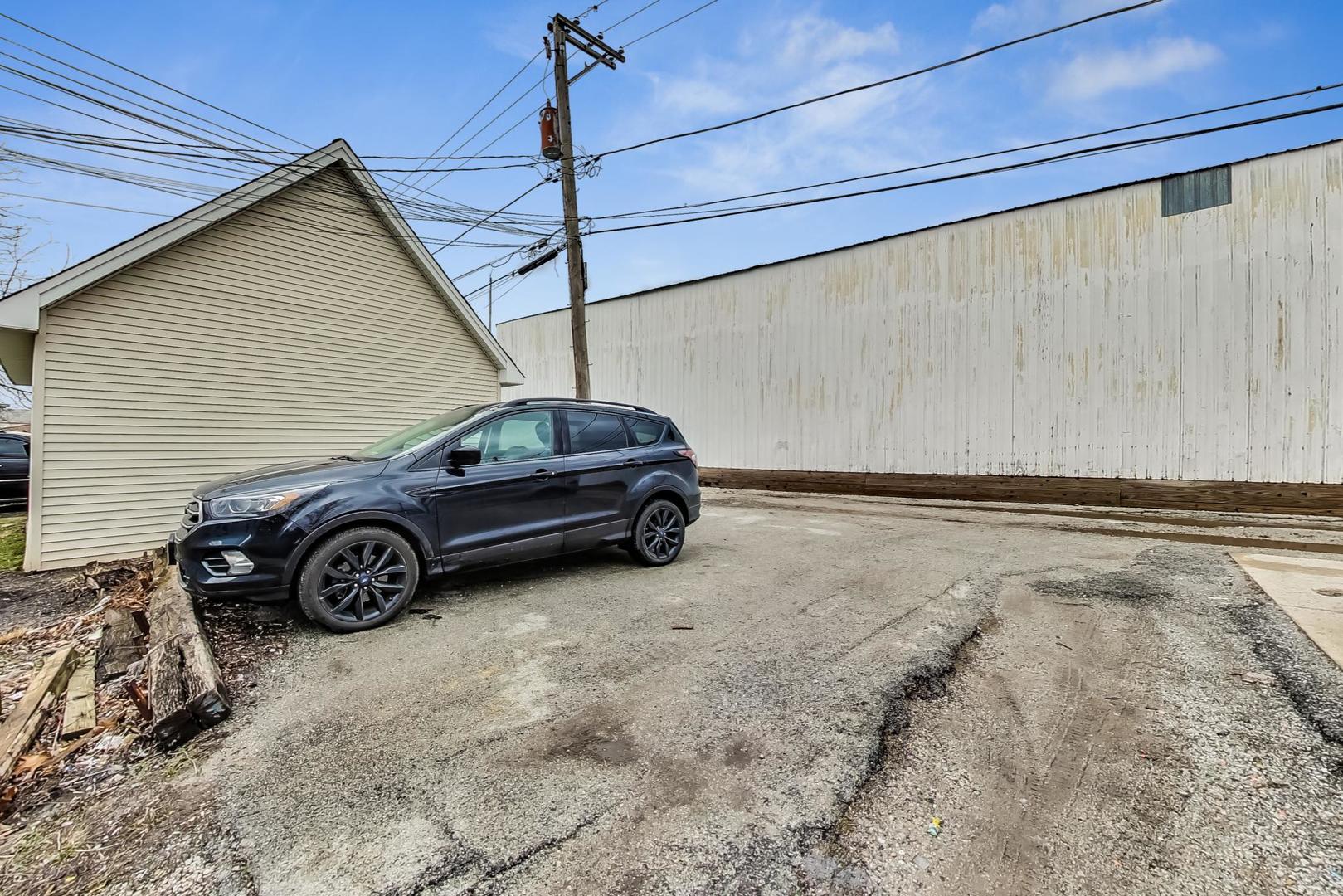 3441 Chicago Road Steger, IL 60475 - Photo 31 of 31 a car parked in front of a house