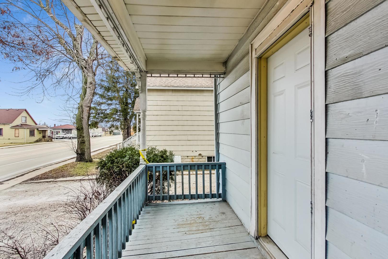3441 Chicago Road Steger, IL 60475 - Photo 5 of 31 a balcony with wooden floor and stairs