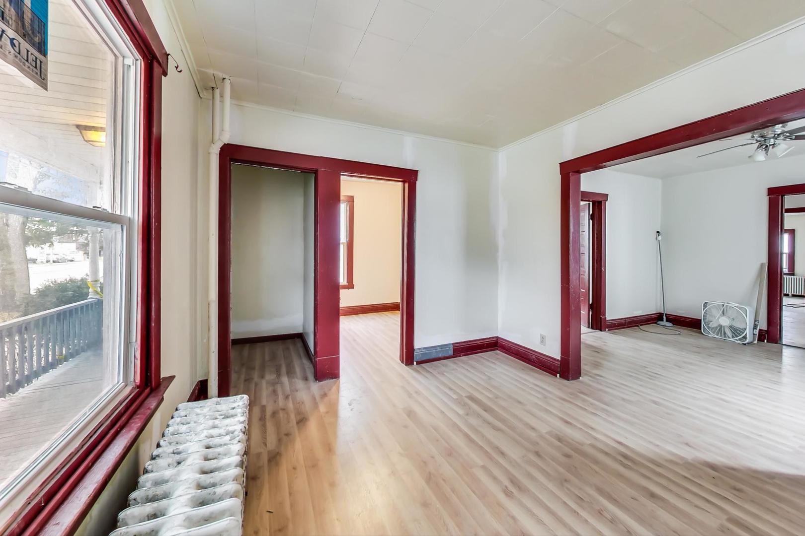 3441 Chicago Road Steger, IL 60475 - Photo 8 of 31 a view of a room with wooden floor and windows