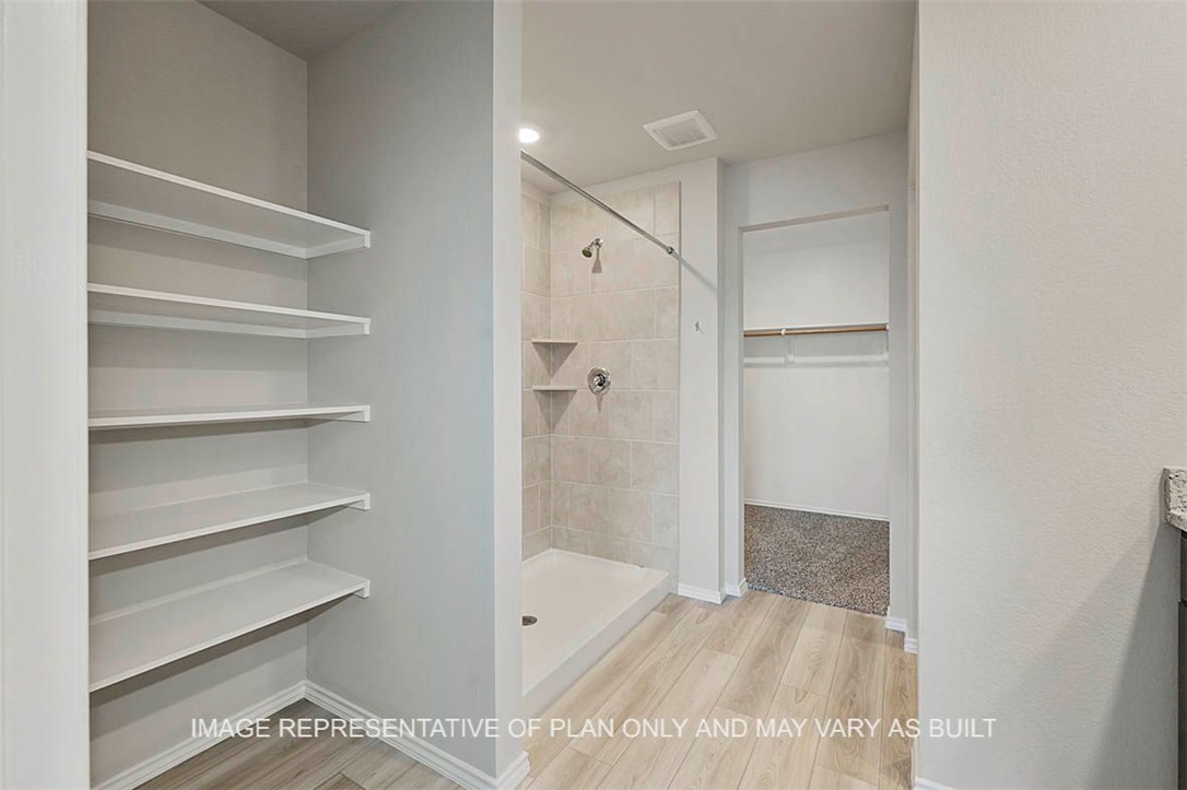 5417-bear Run 5417-bear Run Bryan, TX 77807 - Photo 12 of 18 a bathroom with a bathtub and a shower