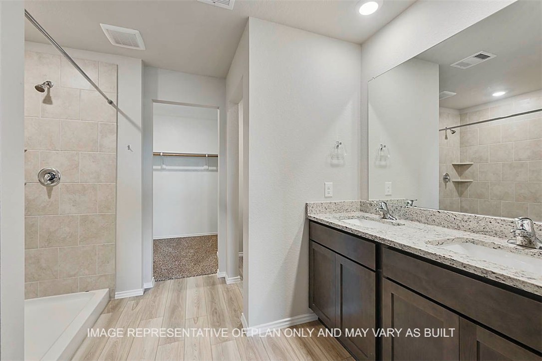 5417-bear Run 5417-bear Run Bryan, TX 77807 - Photo 10 of 18 a bathroom with a sink and a mirror