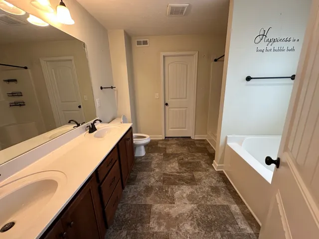 a kitchen with stainless steel appliances granite countertop a stove and a sink
