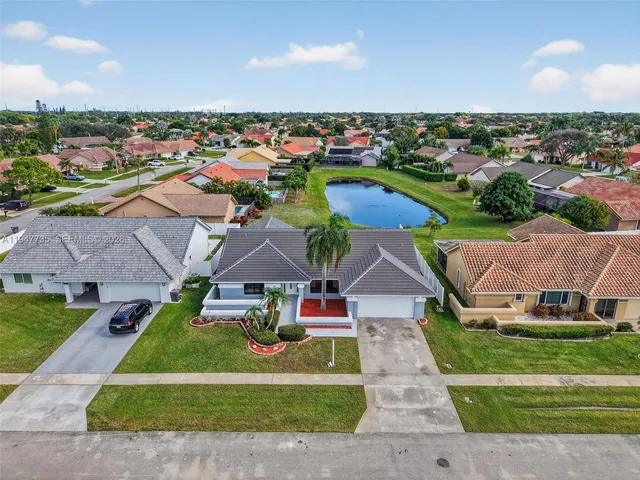 an aerial view of a house with a garden space