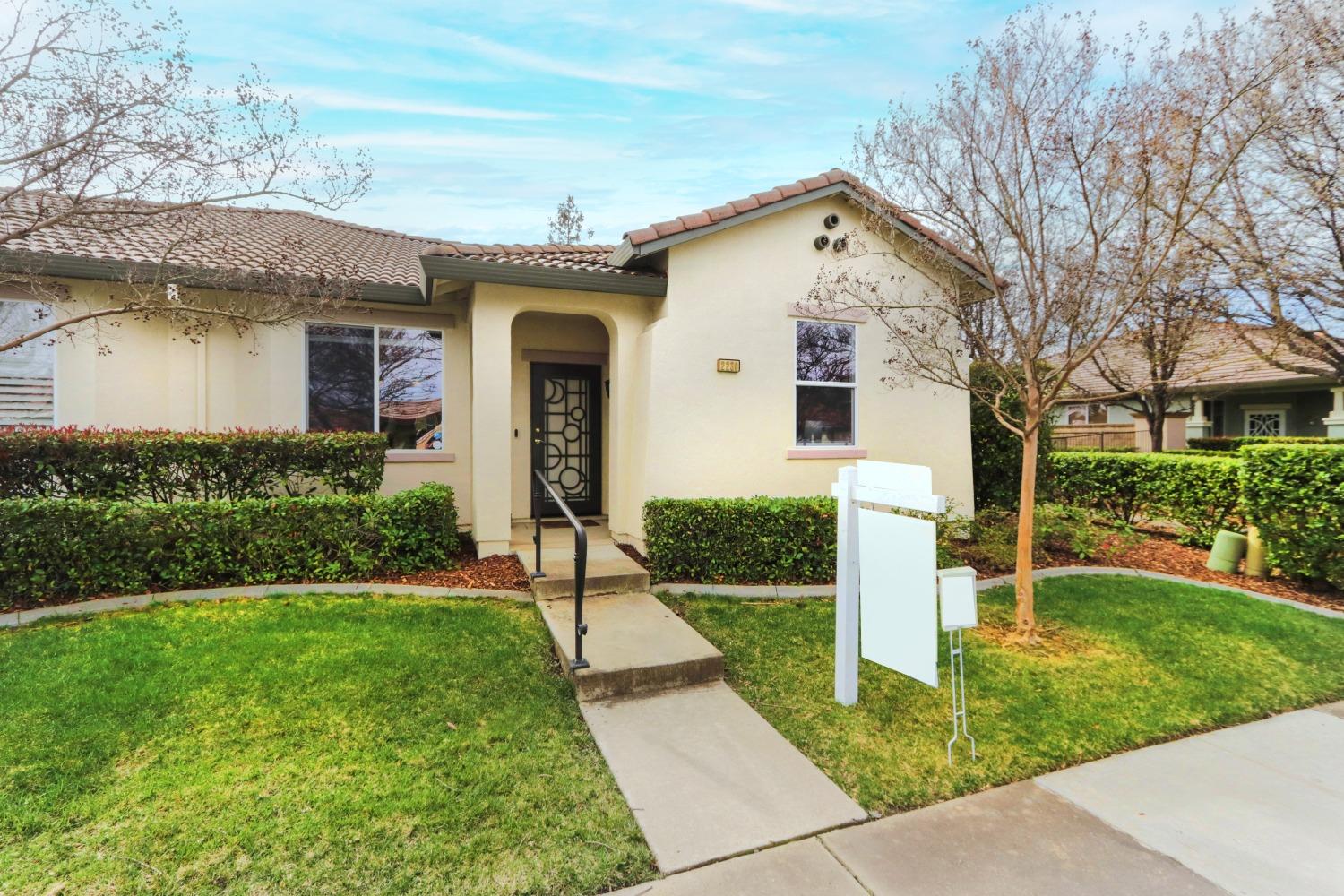 a front view of a house with a yard