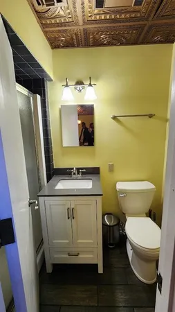 a bathroom with a toilet and a sink