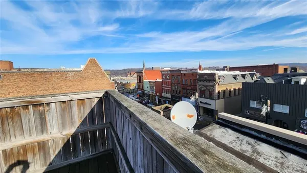 a view of a balcony with city view