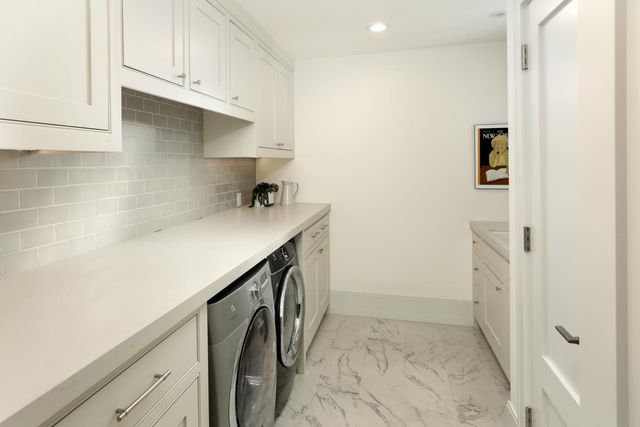 a bathroom with a shower and a sink