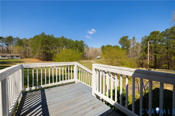a view of a balcony with wooden fence