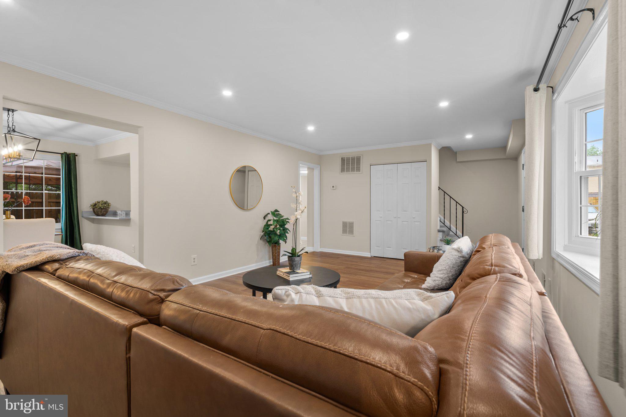 7206 Beverly Park Drive Springfield, VA 22150 - Photo 11 of 47 a living room with furniture and a potted plant