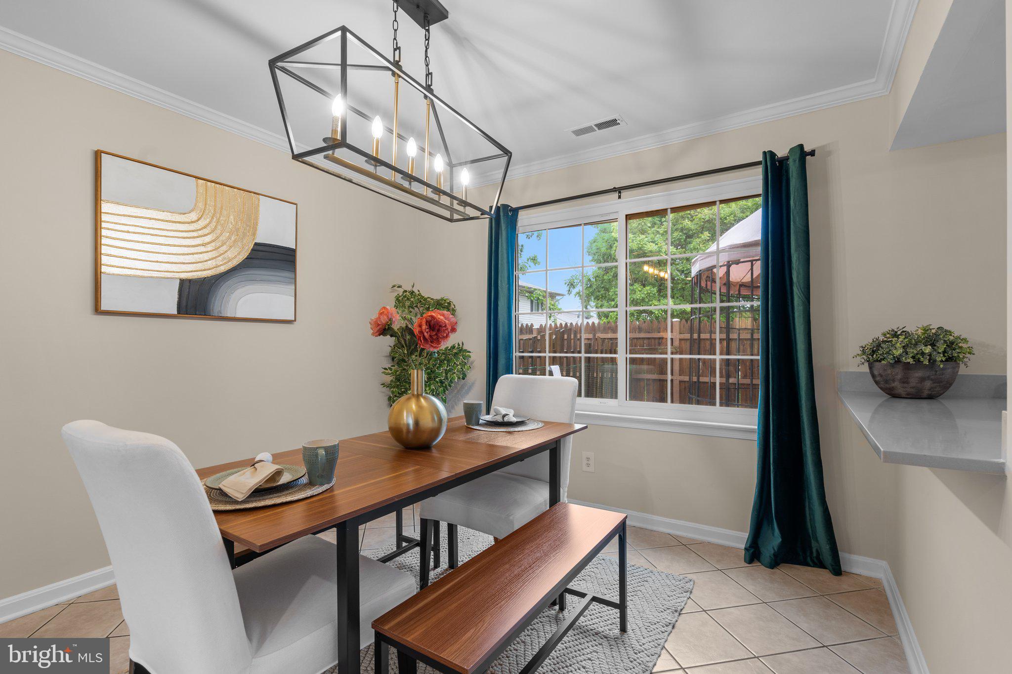 7206 Beverly Park Drive Springfield, VA 22150 - Photo 12 of 47 a view of a dining room with furniture window and wooden floor