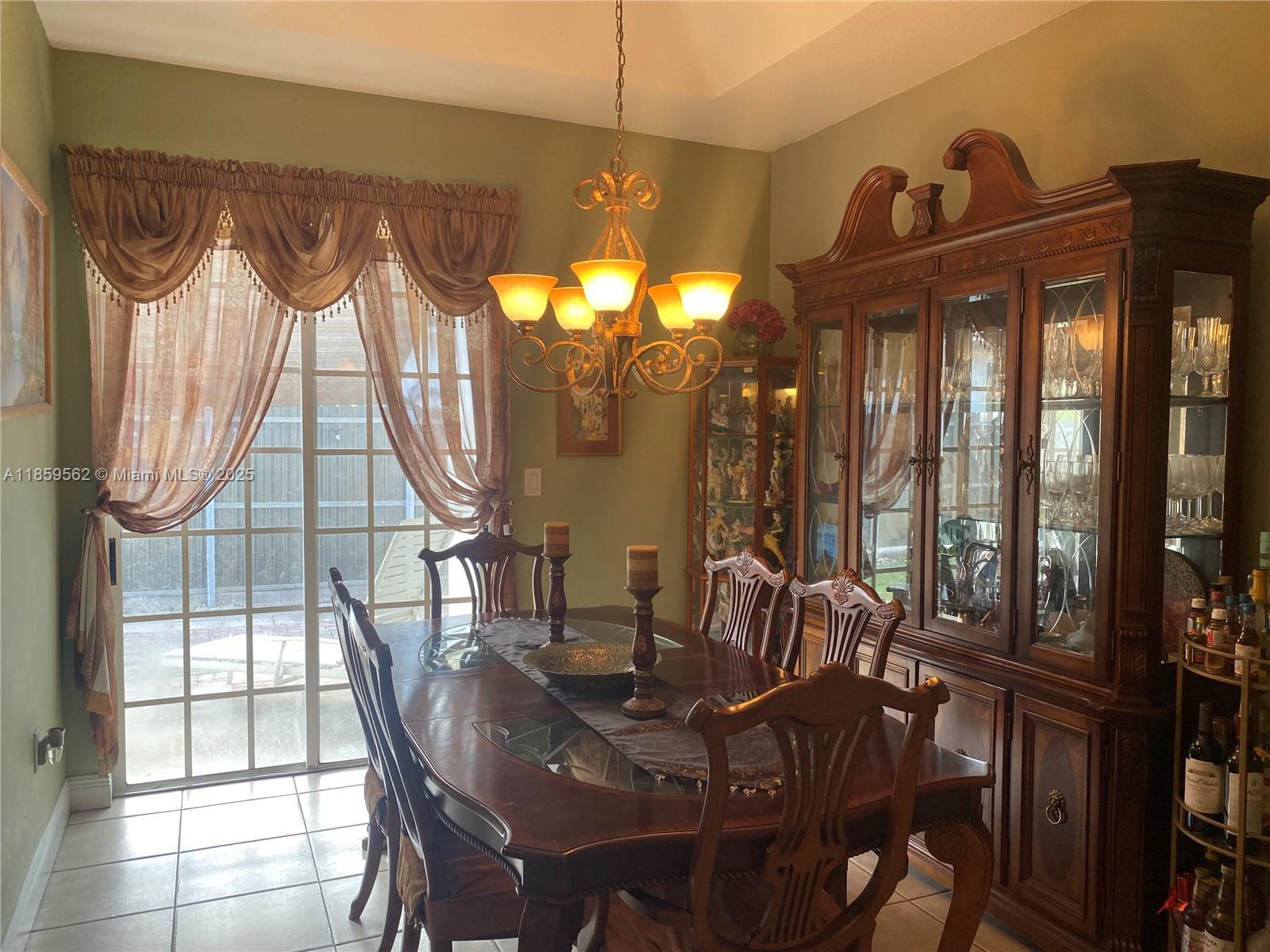 7760 Northwest 163rd Street Miami Lakes, FL 33016 - Photo 16 of 68 a view of a dining room with furniture window and outside view