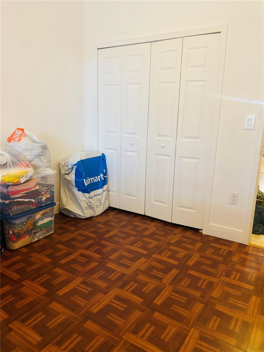 7760 Northwest 163rd Street Miami Lakes, FL 33016 - Photo 31 of 68 a view of a room with wooden floor and cabinet