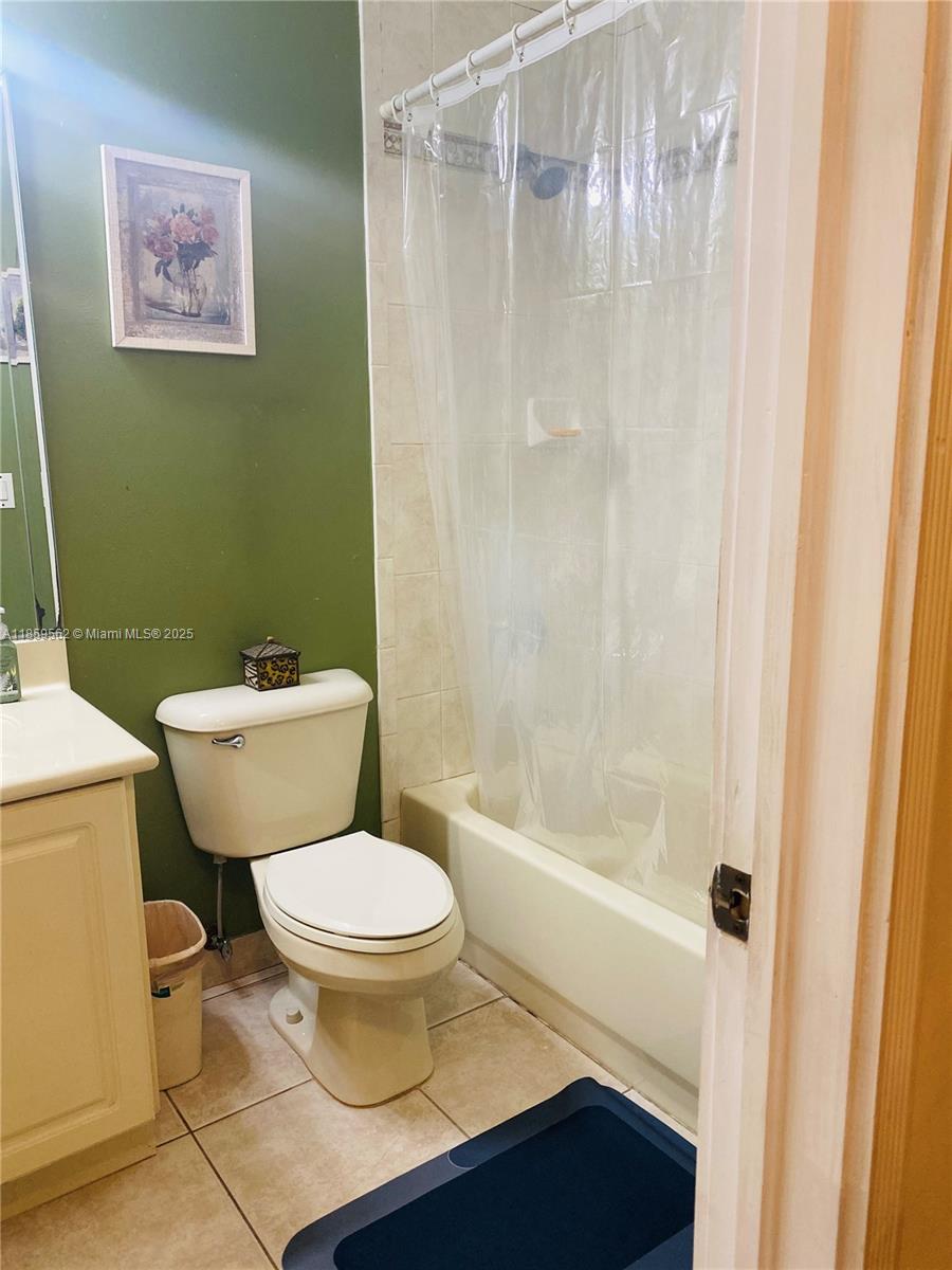 7760 Northwest 163rd Street Miami Lakes, FL 33016 - Photo 37 of 68 a bathroom with a toilet and a shower