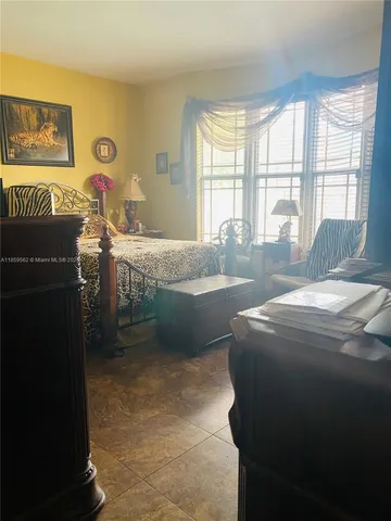 a swimming pool with outdoor seating