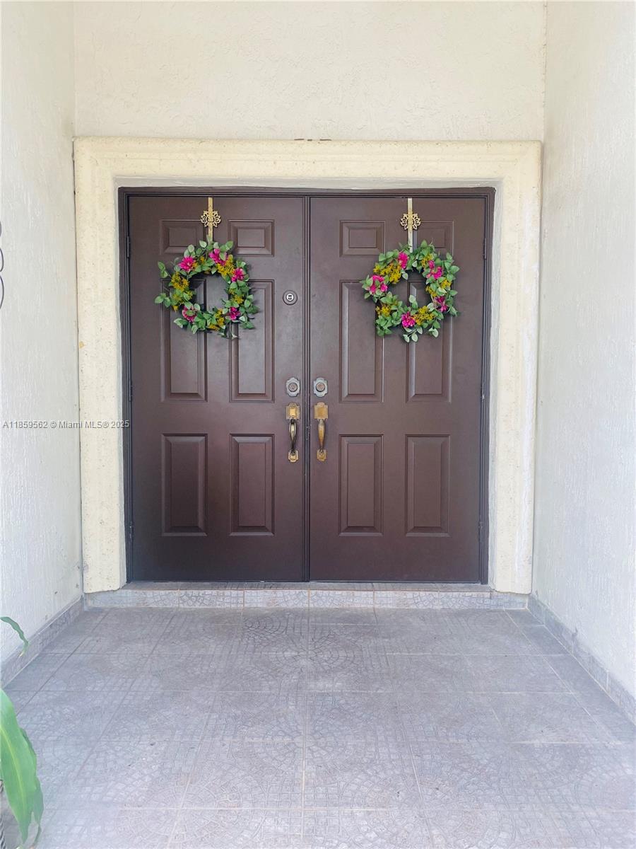 7760 Northwest 163rd Street Miami Lakes, FL 33016 - Photo 4 of 68 a front view of a house