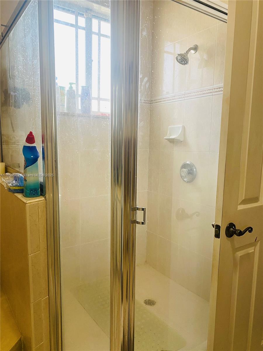 7760 Northwest 163rd Street Miami Lakes, FL 33016 - Photo 45 of 68 a bathroom with a shower