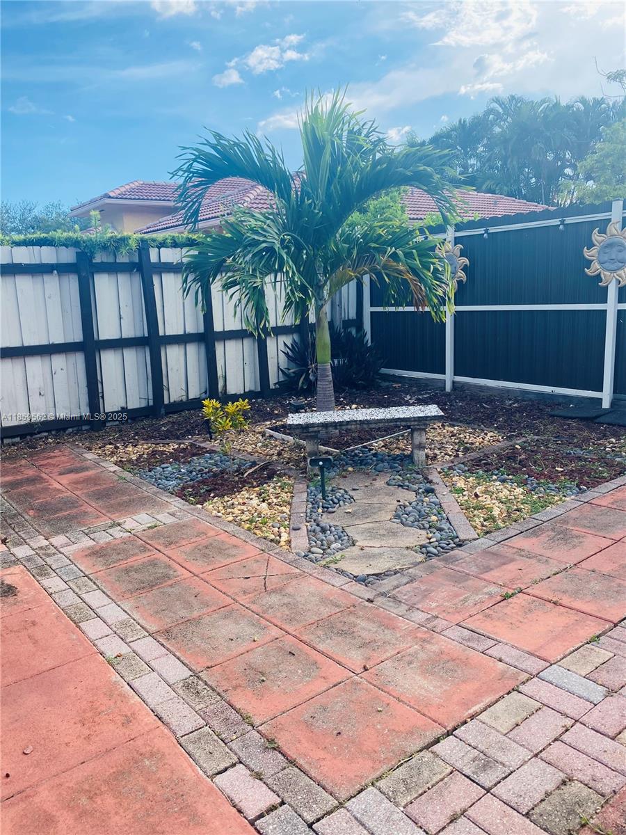 7760 Northwest 163rd Street Miami Lakes, FL 33016 - Photo 64 of 68 a view of a house with a yard