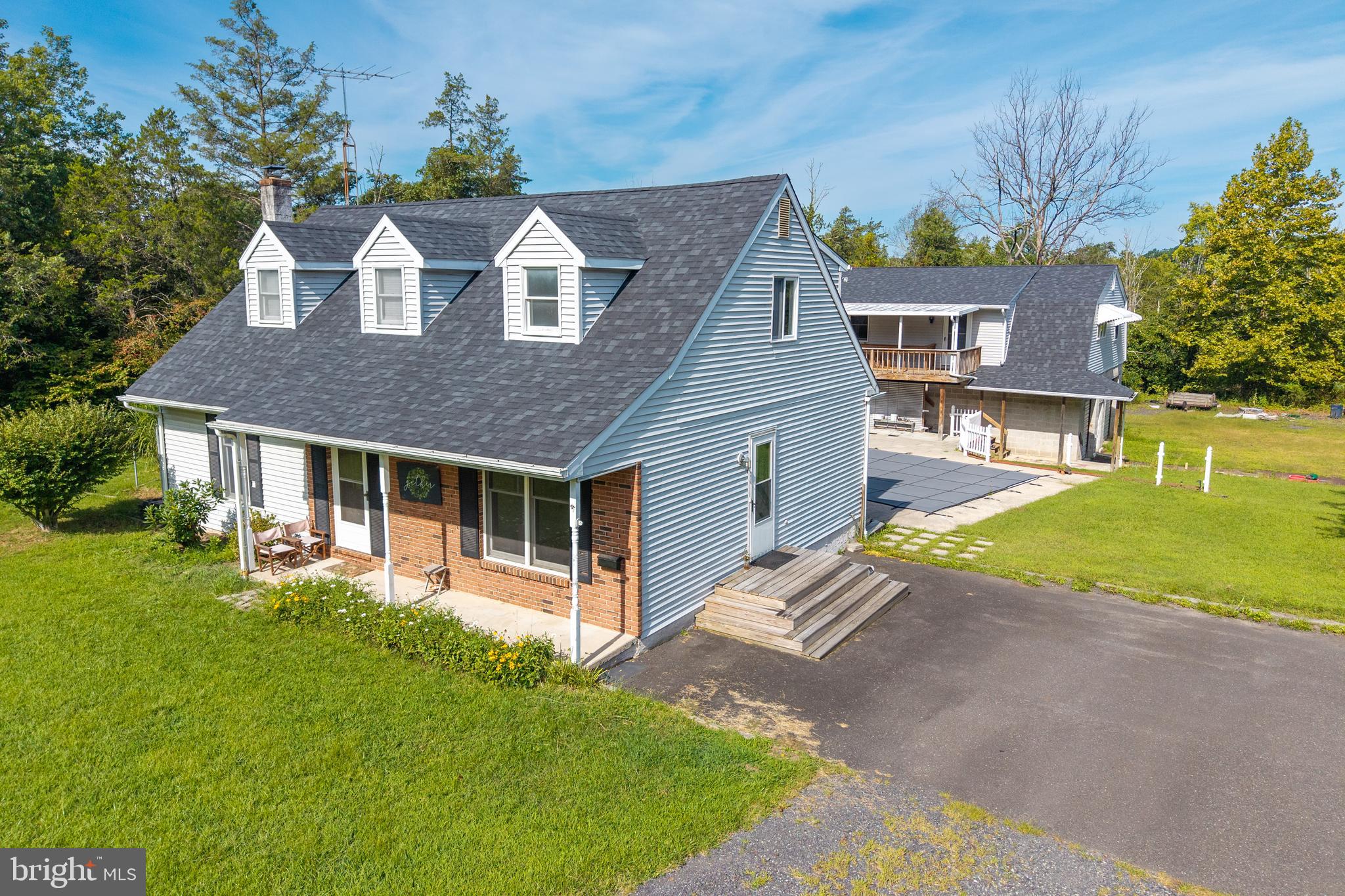 5509 Hoppenville Road Green Lane, PA 18054 - Photo 1 of 70 a front view of a house with a yard and garage